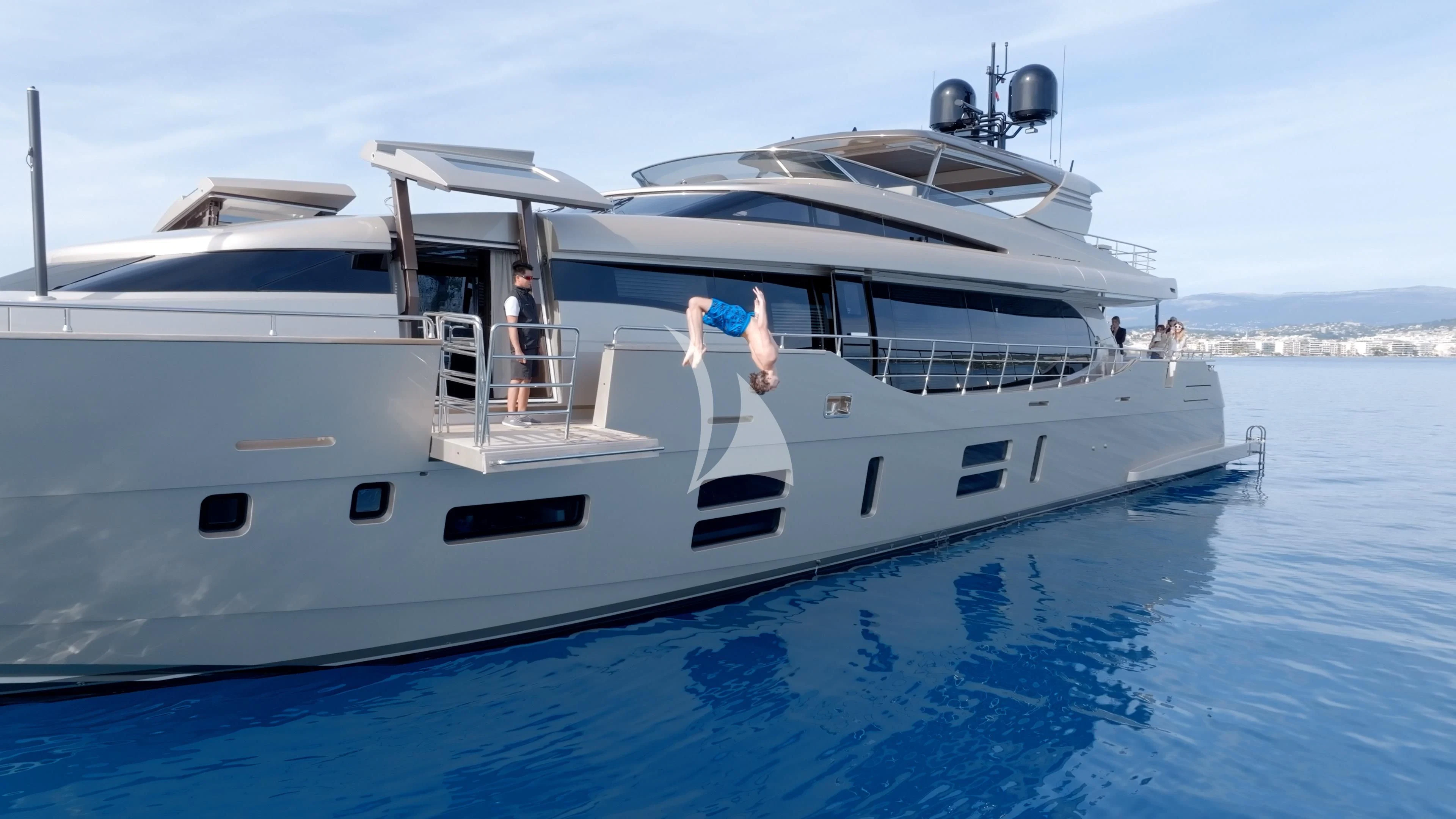 a white yacht with people on it aboard THE PALM Yacht for Sale