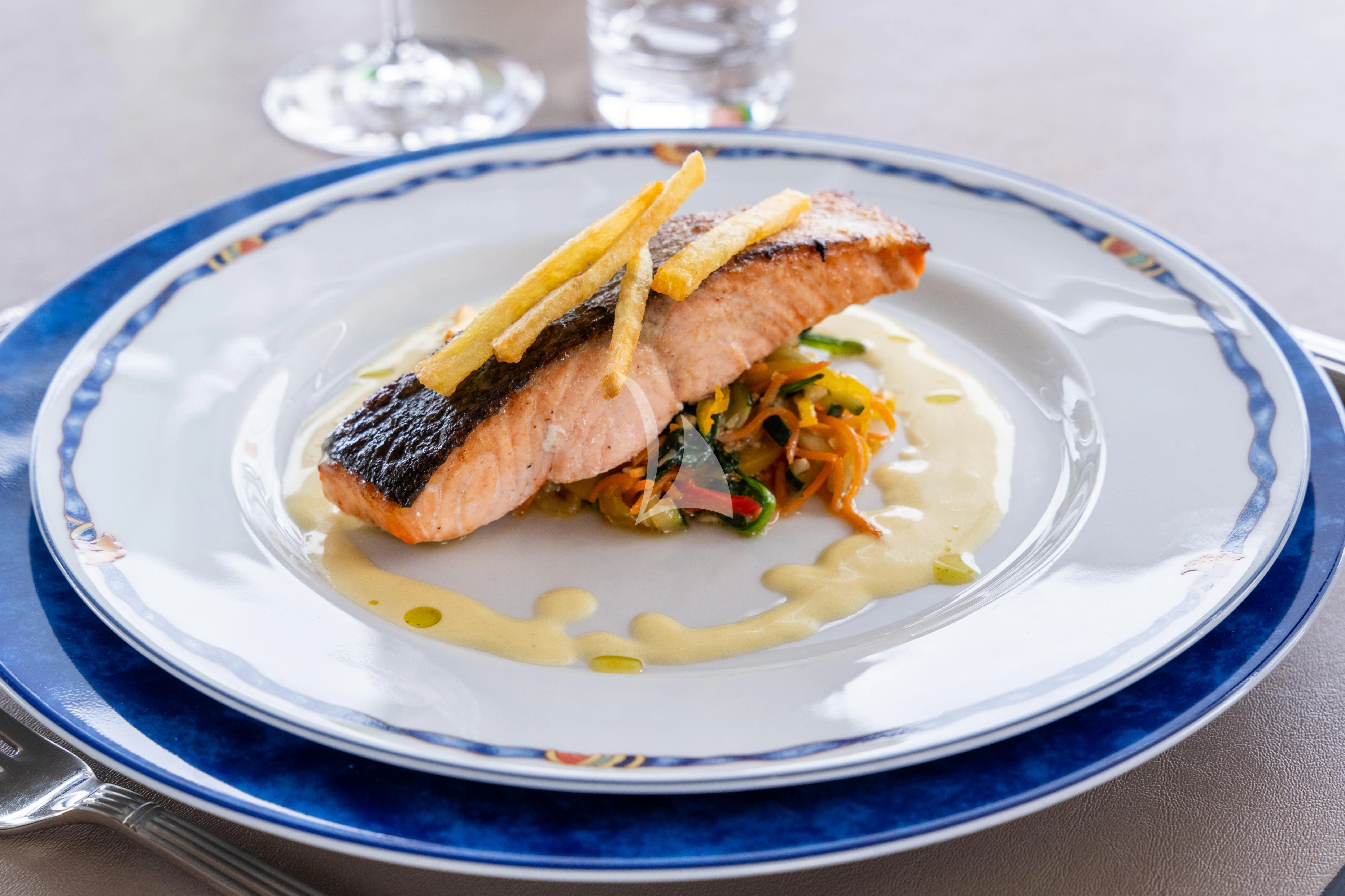 a plate of food aboard THE PALM Yacht for Sale