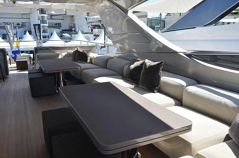 a room with a couch and a table aboard THE PALM Yacht for Sale
