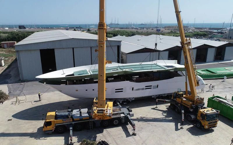a plane is being prepared for a flight aboard THE PALM Yacht for Sale