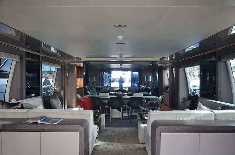 a room with a couch and a table and chairs aboard THE PALM Yacht for Sale