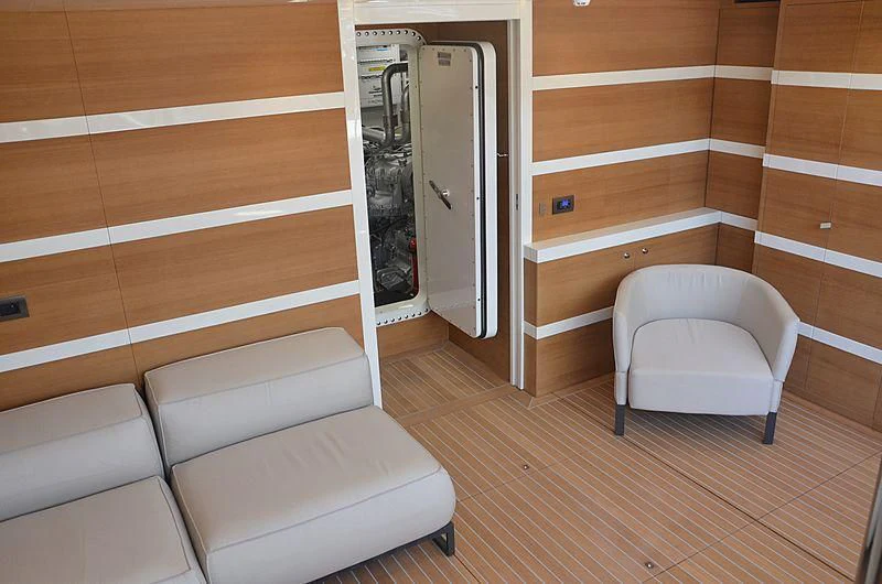 a room with a chair and a bed aboard THE PALM Yacht for Sale