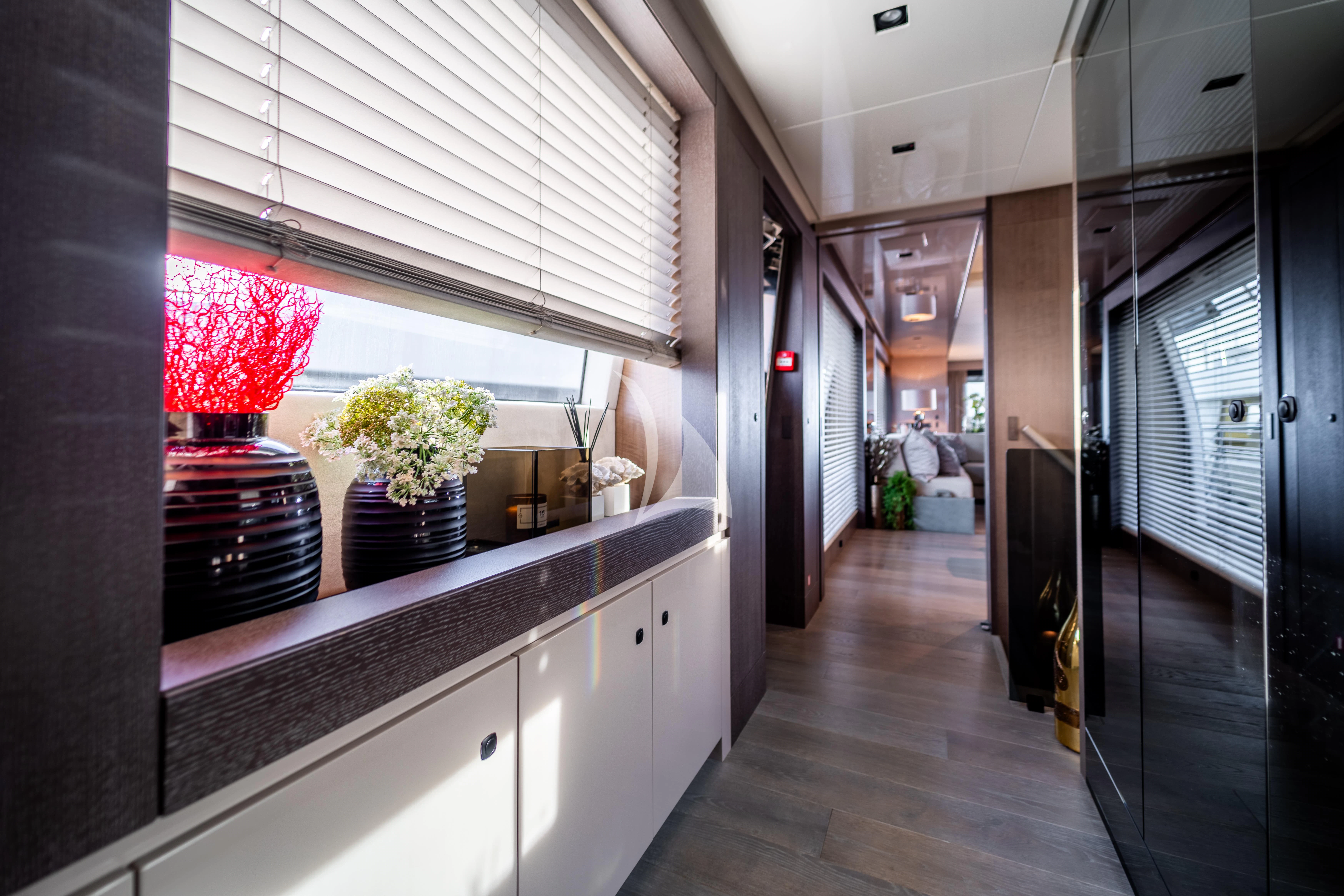 a kitchen with white cabinets aboard THE PALM Yacht for Sale
