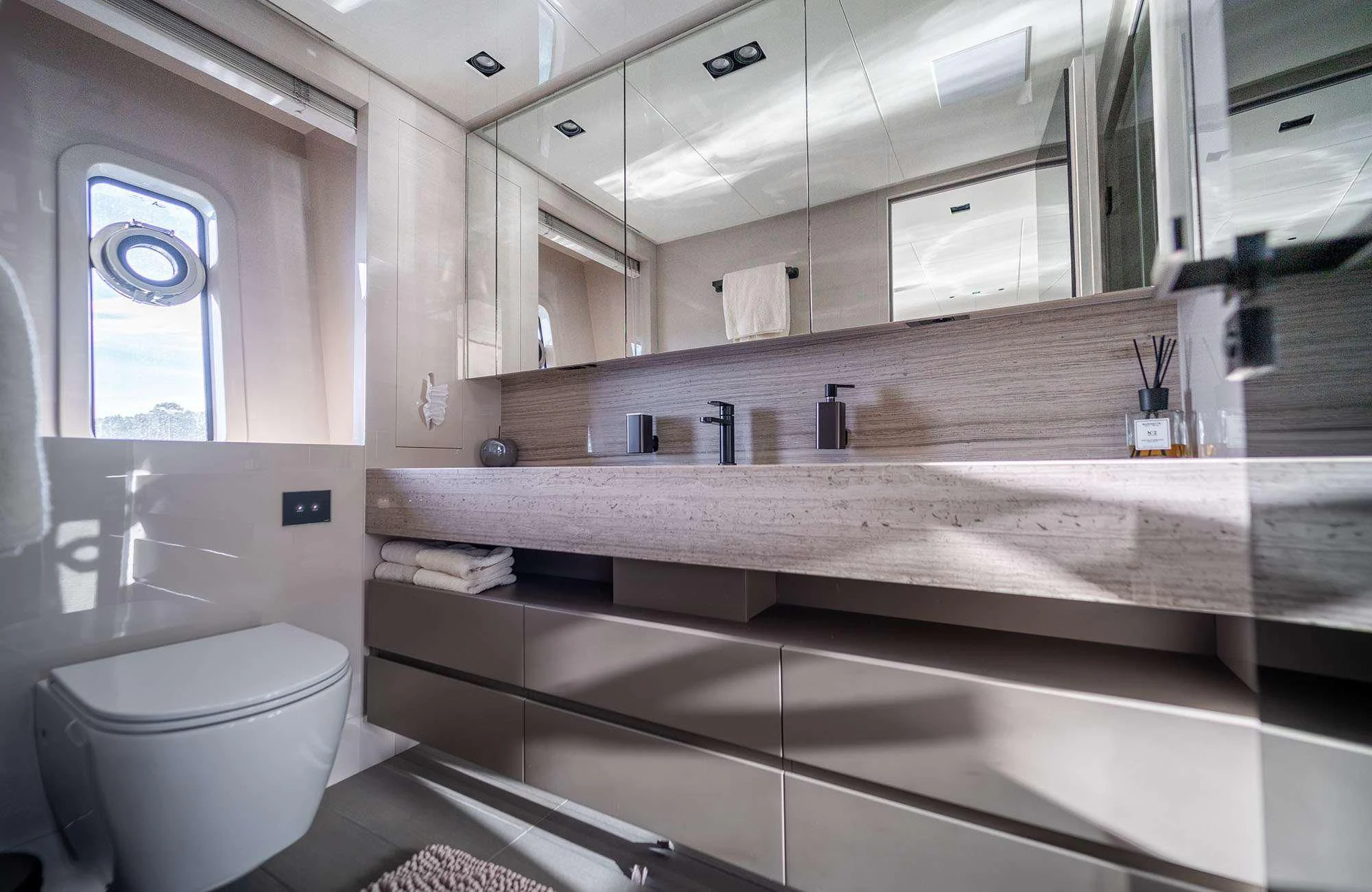 a bathroom with a large mirror aboard THE PALM Yacht for Sale