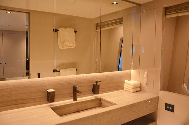 a bathroom with a large mirror aboard THE PALM Yacht for Sale