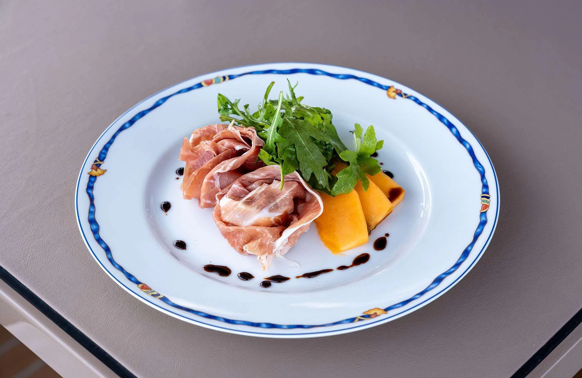 a plate of shrimp and vegetables aboard THE PALM Yacht for Sale