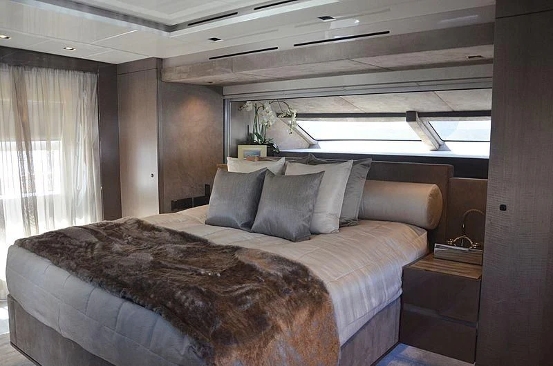 a bed with a large bed aboard THE PALM Yacht for Sale