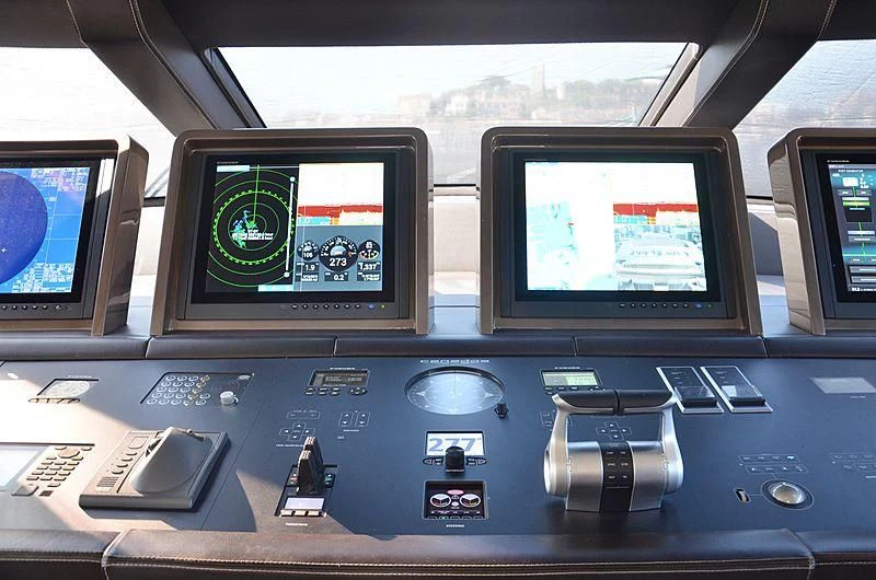 a computer with a monitor and other monitors aboard THE PALM Yacht for Sale