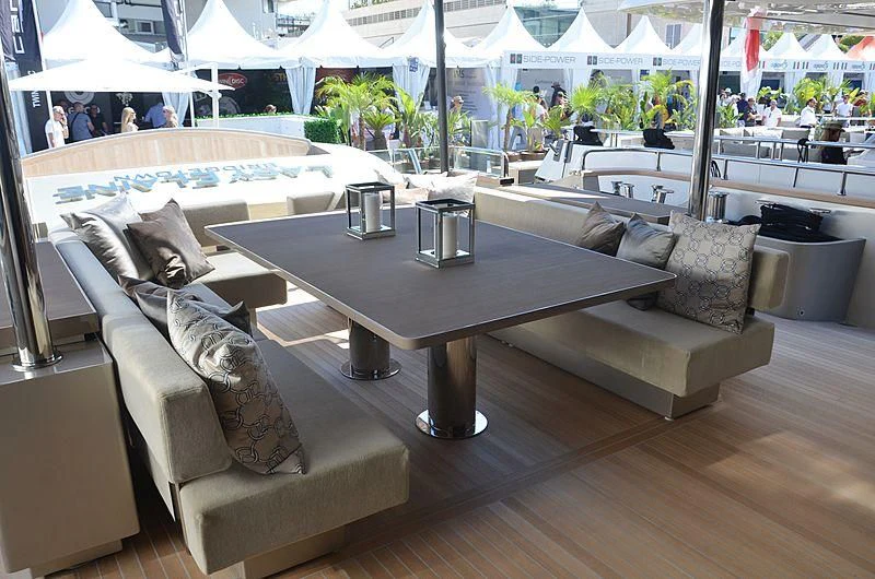 a table with chairs around it aboard THE PALM Yacht for Sale