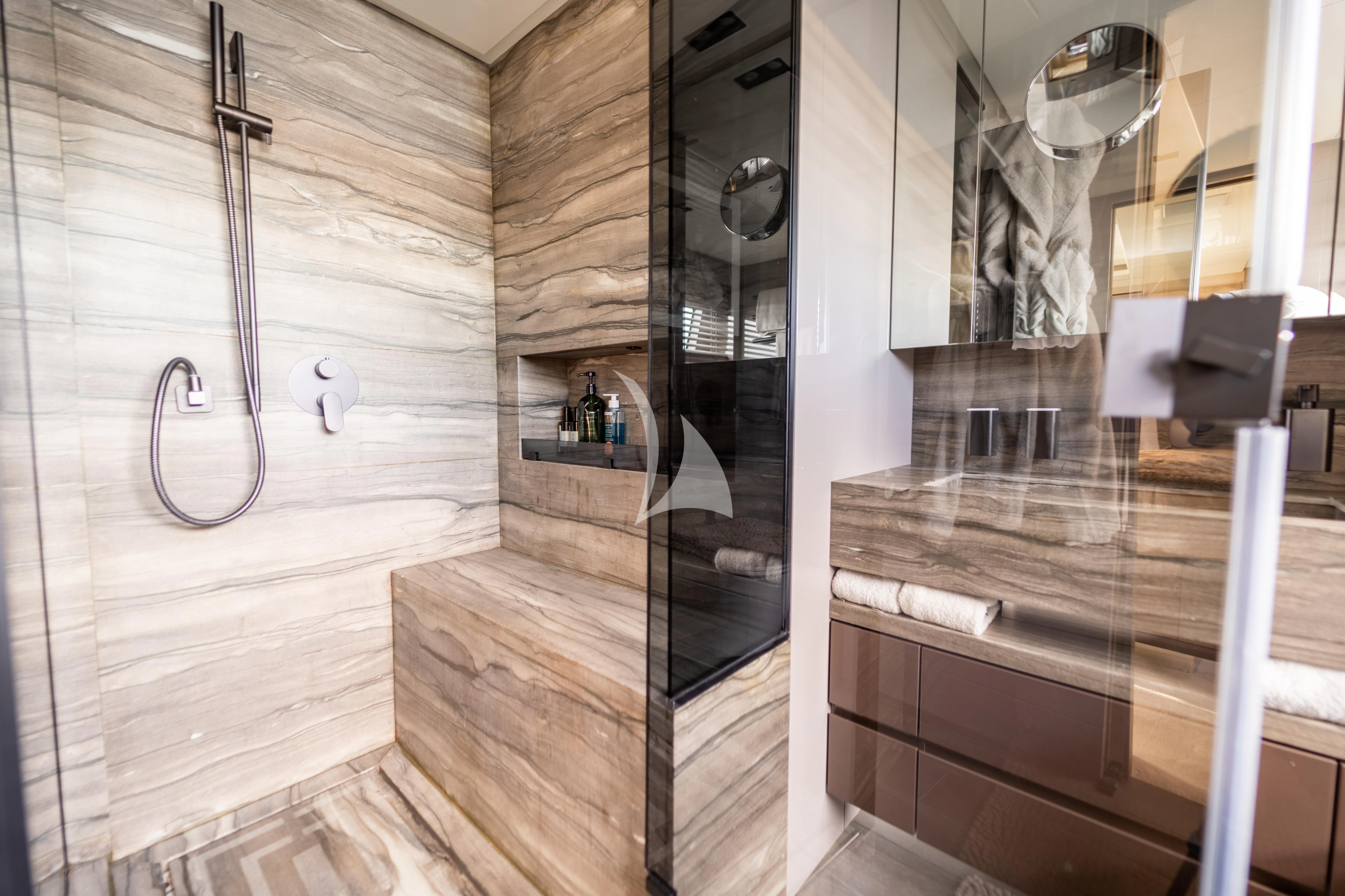 a bathroom with a shower unit aboard THE PALM Yacht for Sale