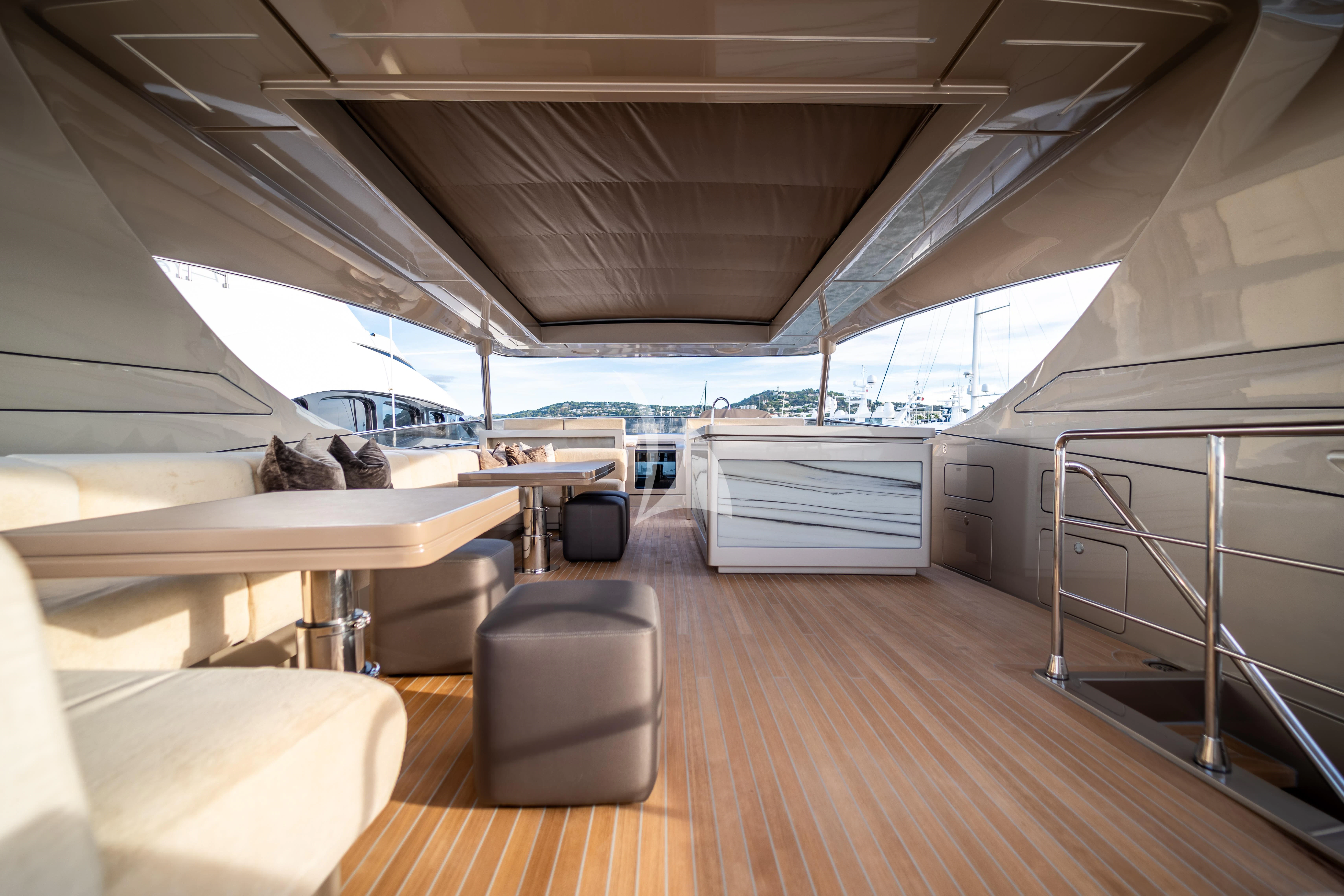 inside of a building with a large window and a cat lying on the floor aboard THE PALM Yacht for Sale