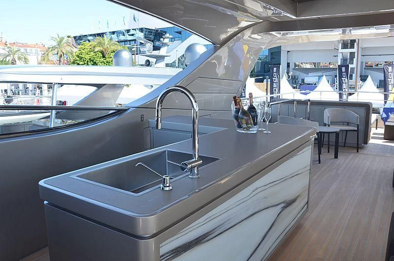 a kitchen with a large glass window aboard THE PALM Yacht for Sale