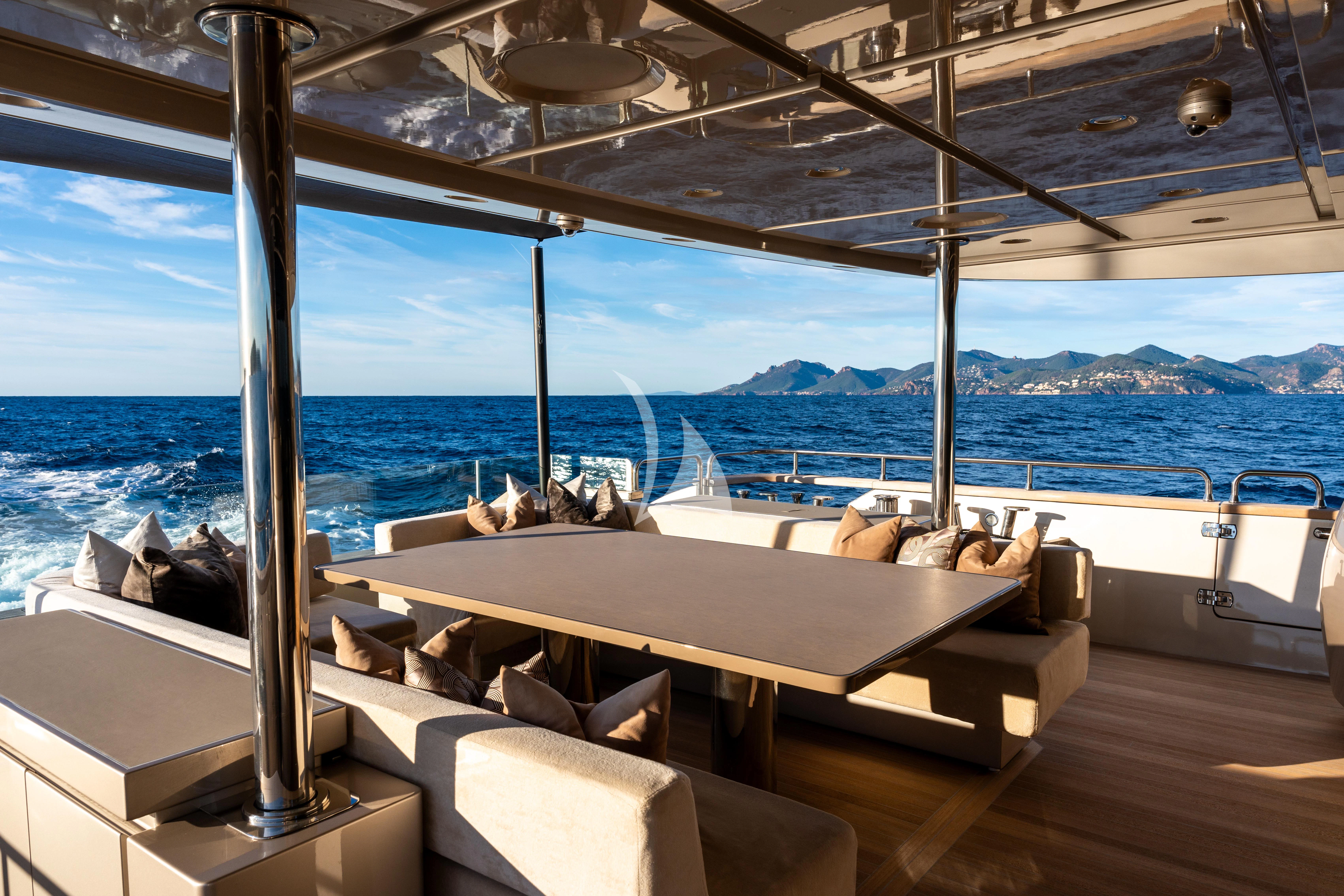 a room with a bed and a view of the ocean aboard THE PALM Yacht for Sale