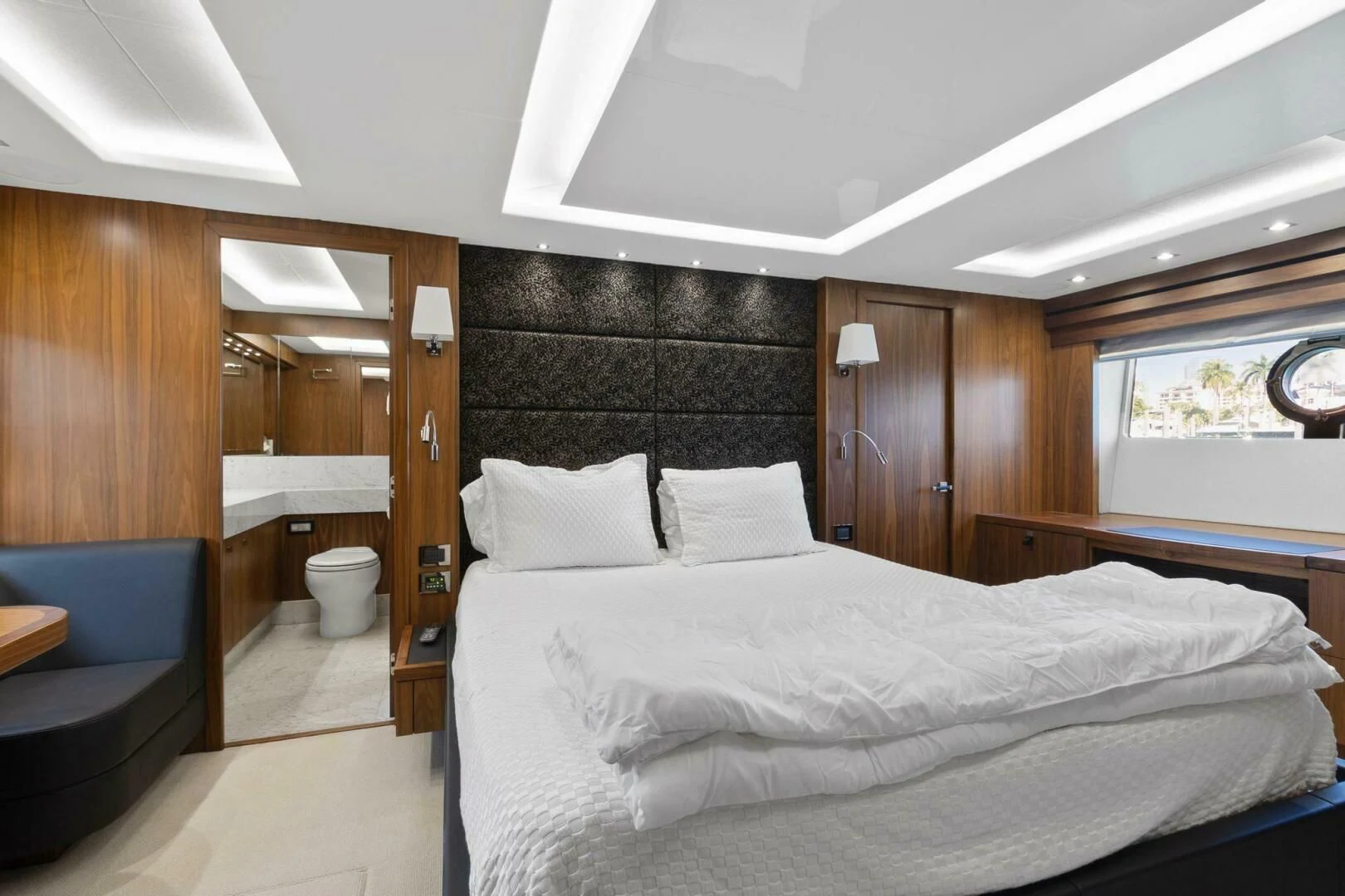 a room with a bed and a chair aboard ALEXA Yacht for Sale