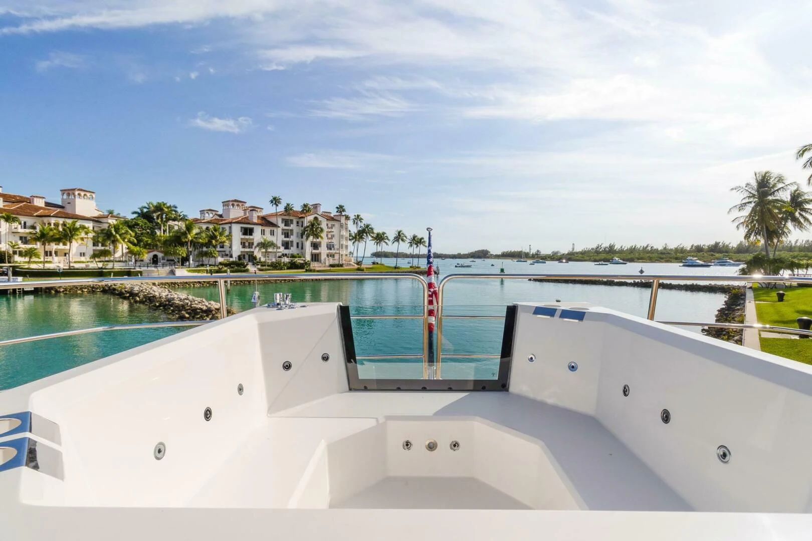 a white boat on a body of water aboard ALEXA Yacht for Sale