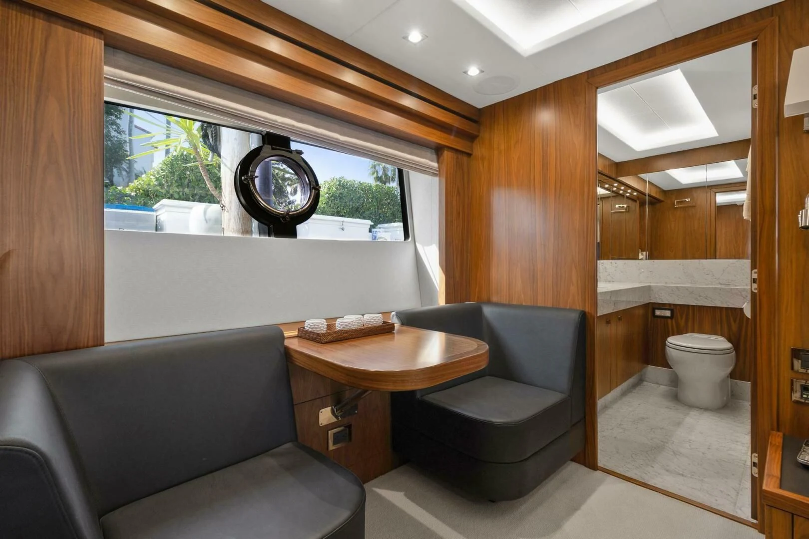 a room with a table and a couch aboard ALEXA Yacht for Sale