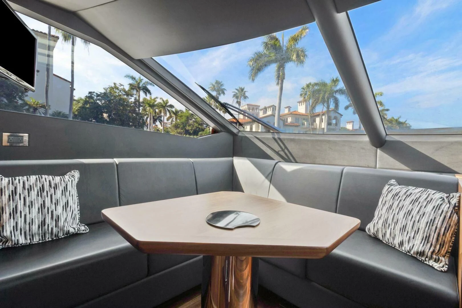 a table on a couch aboard ALEXA Yacht for Sale