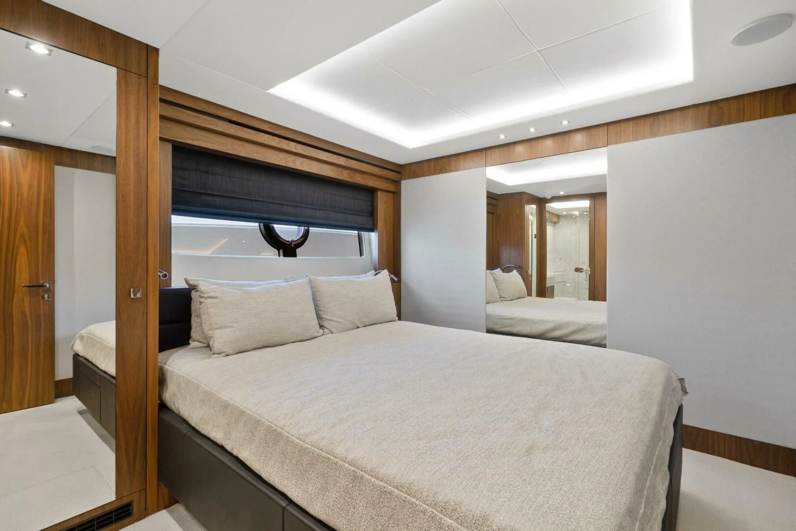 a bed with white sheets aboard ALEXA Yacht for Sale
