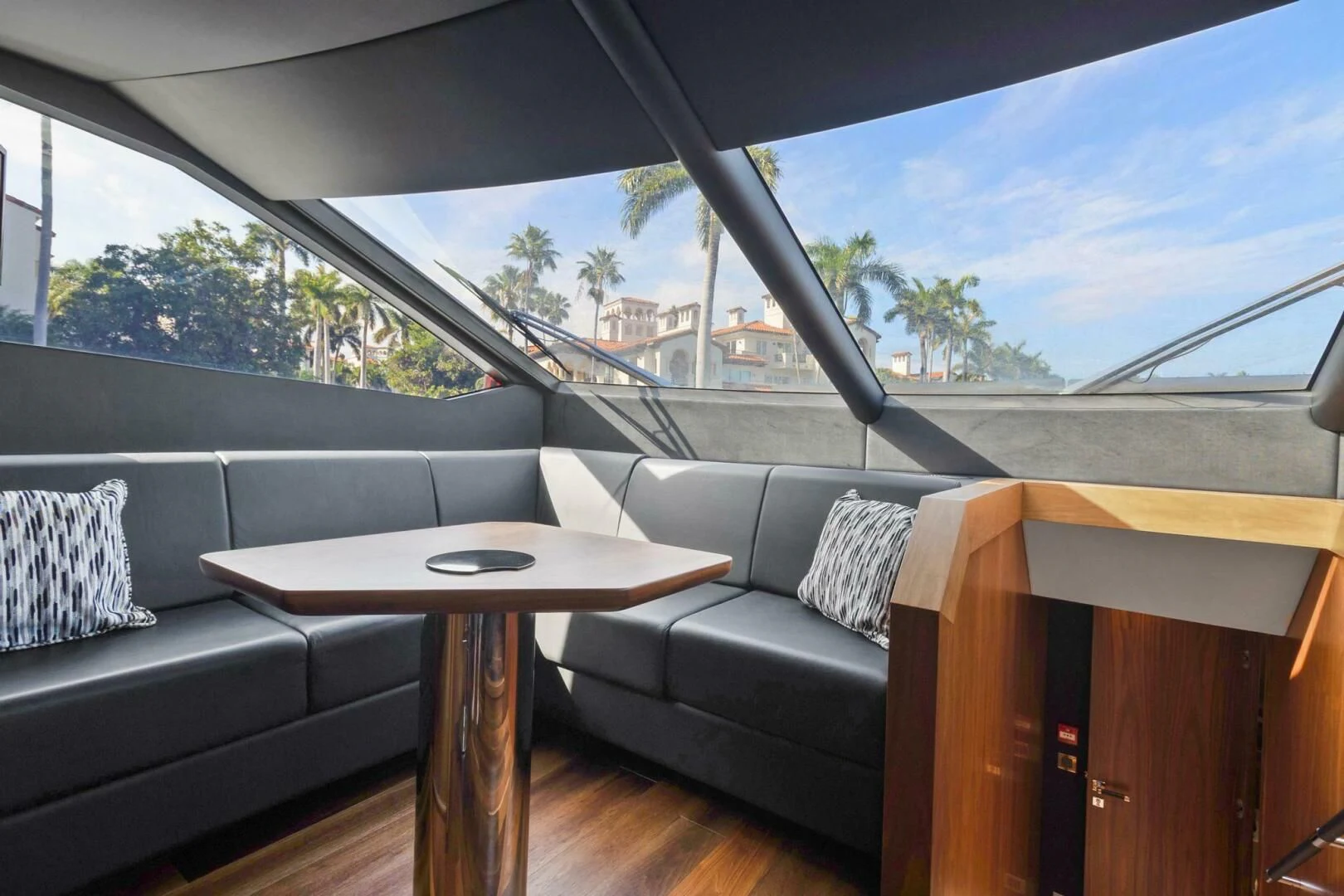 a couch and a table in a room with a window aboard ALEXA Yacht for Sale