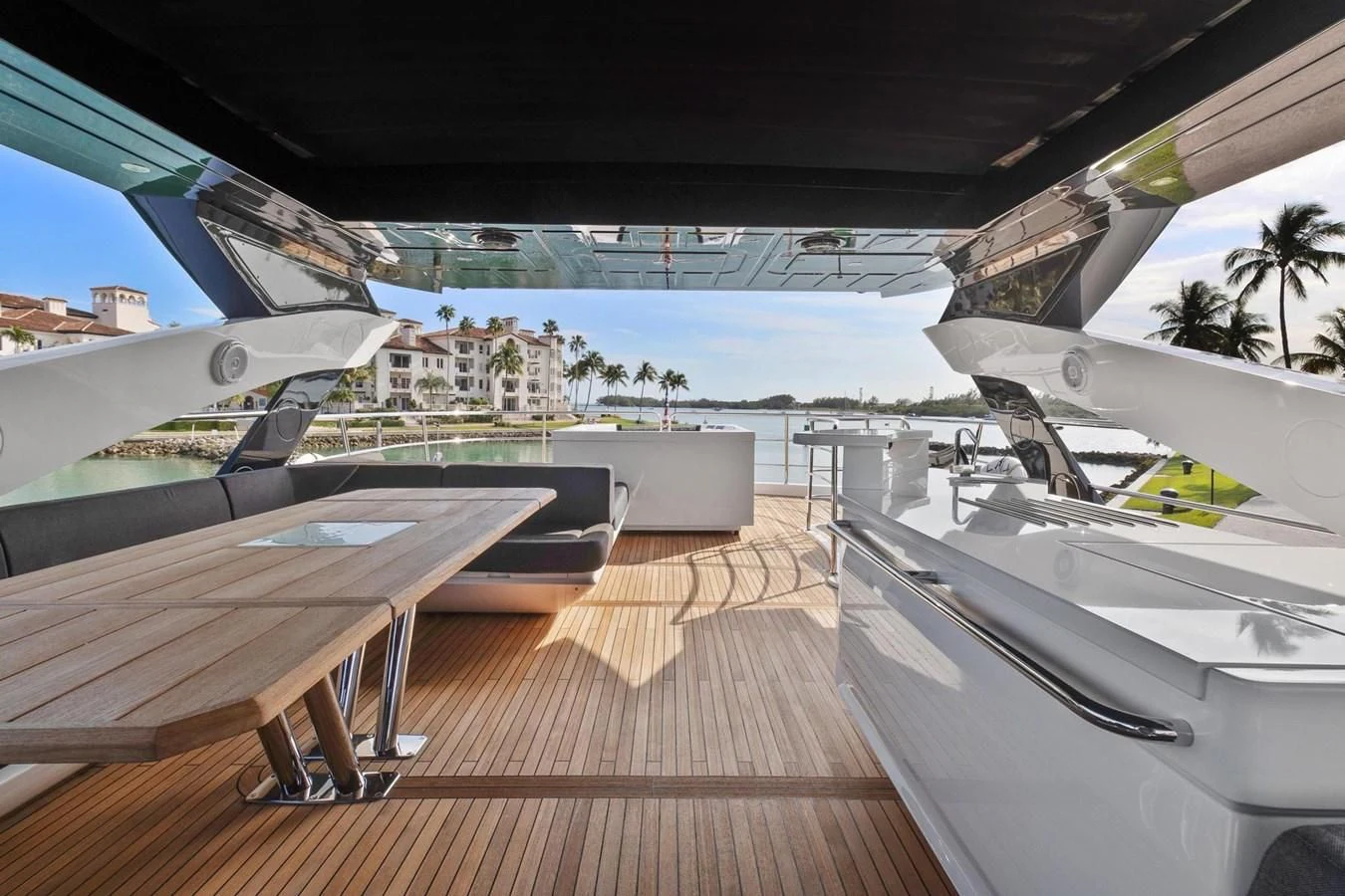 a deck with a deck and a pool and a building on the side aboard ALEXA Yacht for Sale