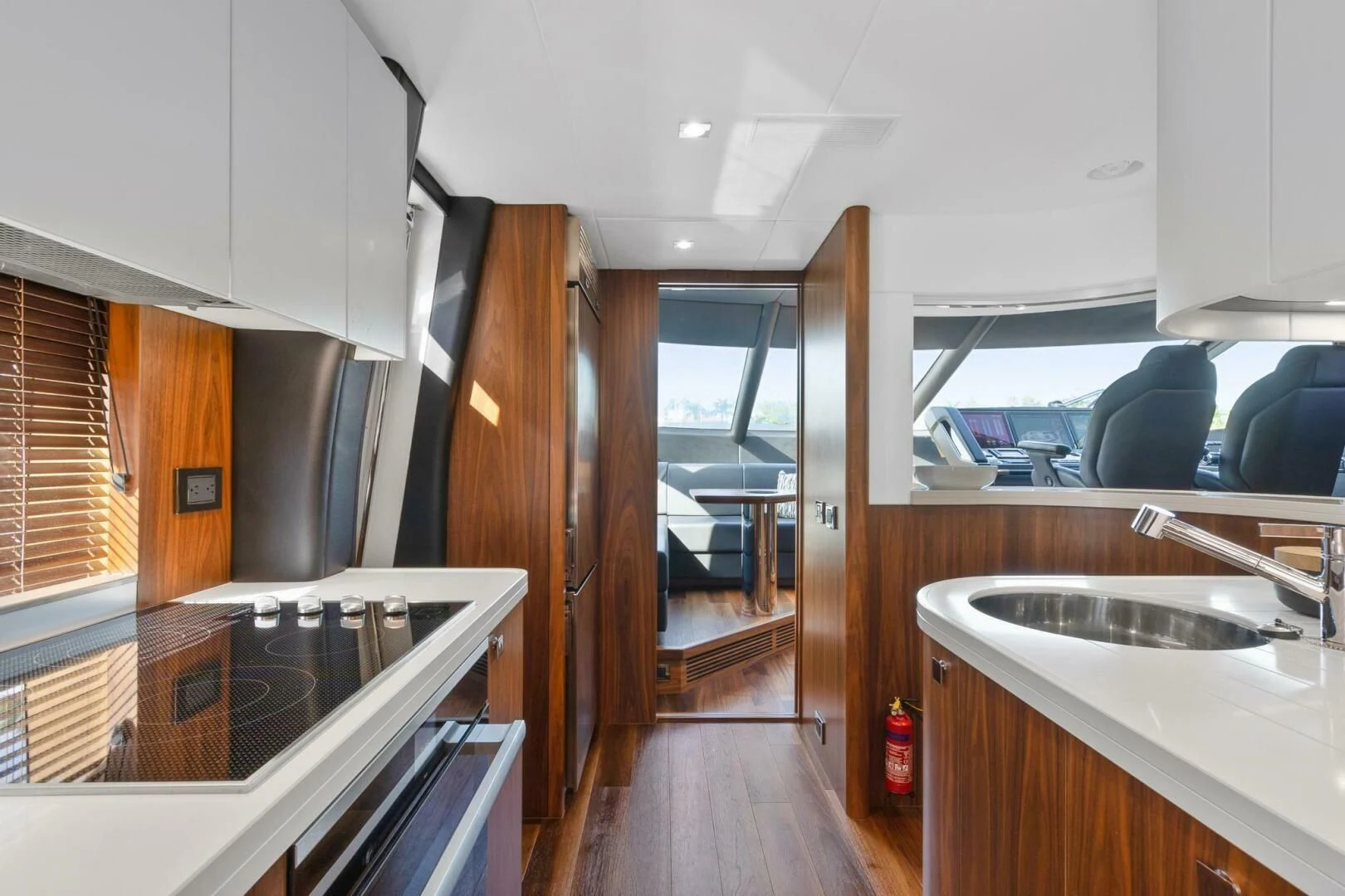 a kitchen with wooden cabinets aboard ALEXA Yacht for Sale