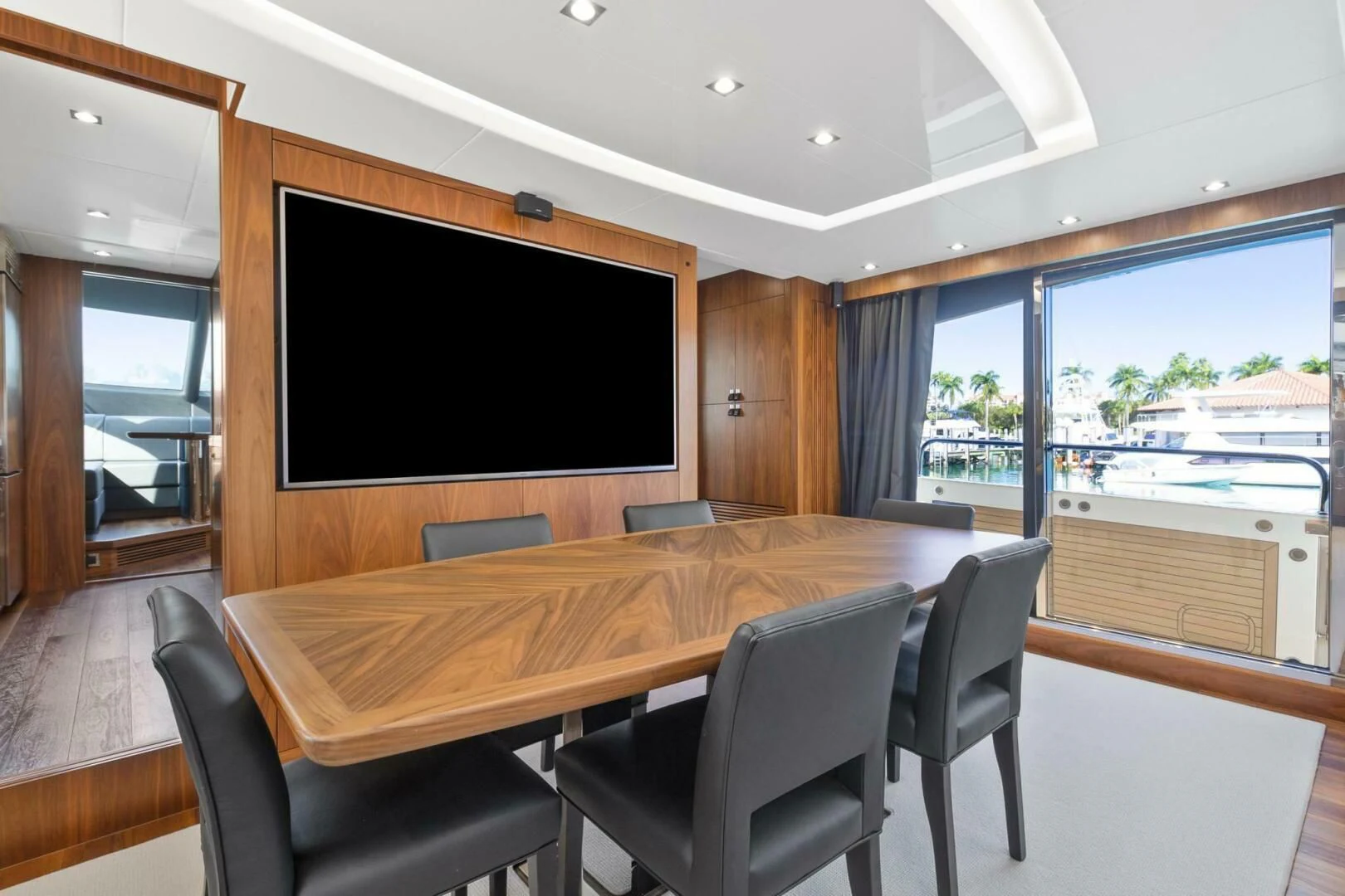 a conference room with a table and chairs aboard ALEXA Yacht for Sale
