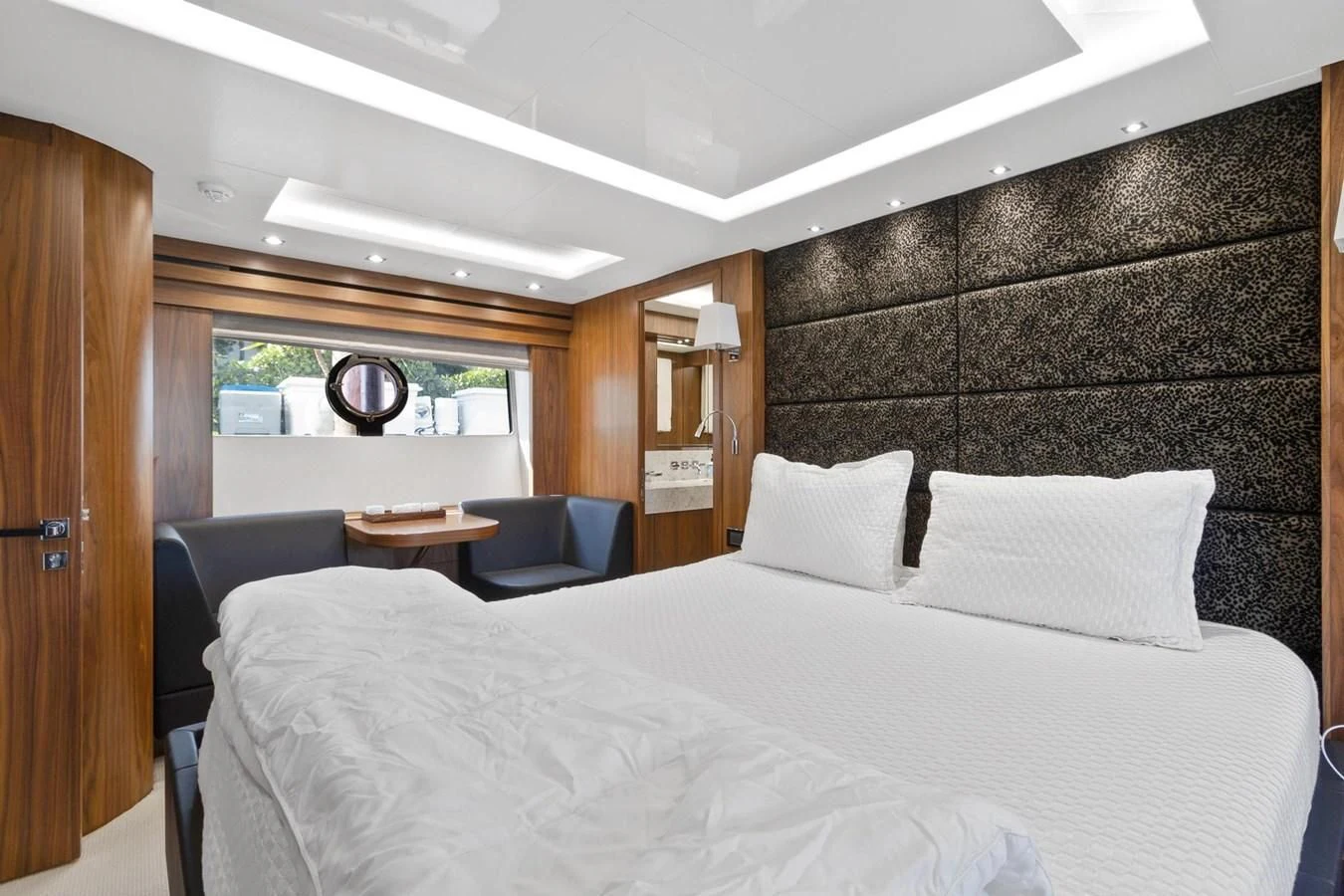 a bed with white sheets aboard ALEXA Yacht for Sale