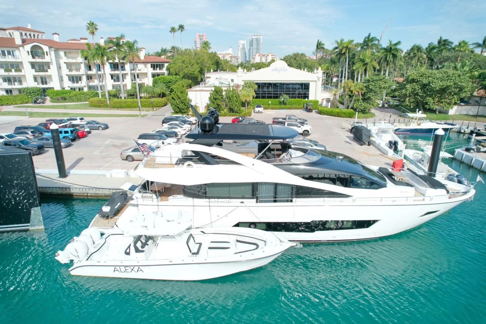 a large white boat in a harbor aboard ALEXA Yacht for Sale