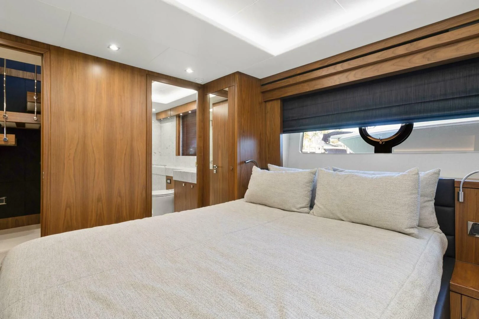 a bed with a white sheet aboard ALEXA Yacht for Sale