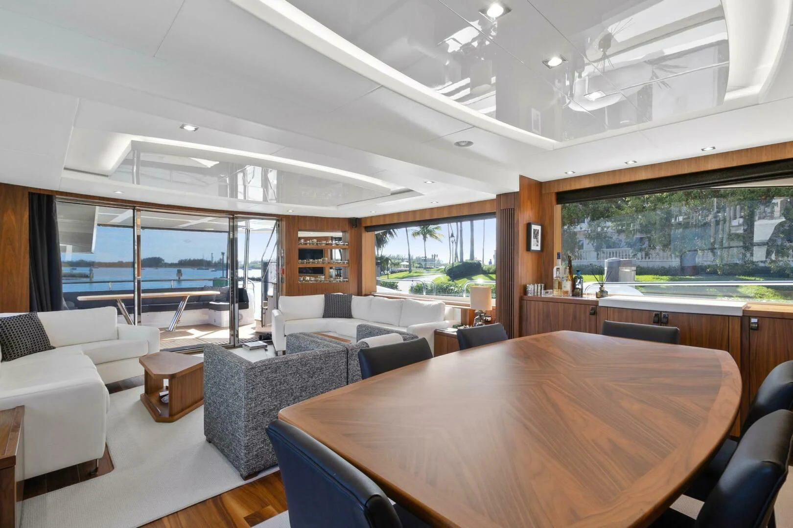 a large room with a table and chairs aboard ALEXA Yacht for Sale