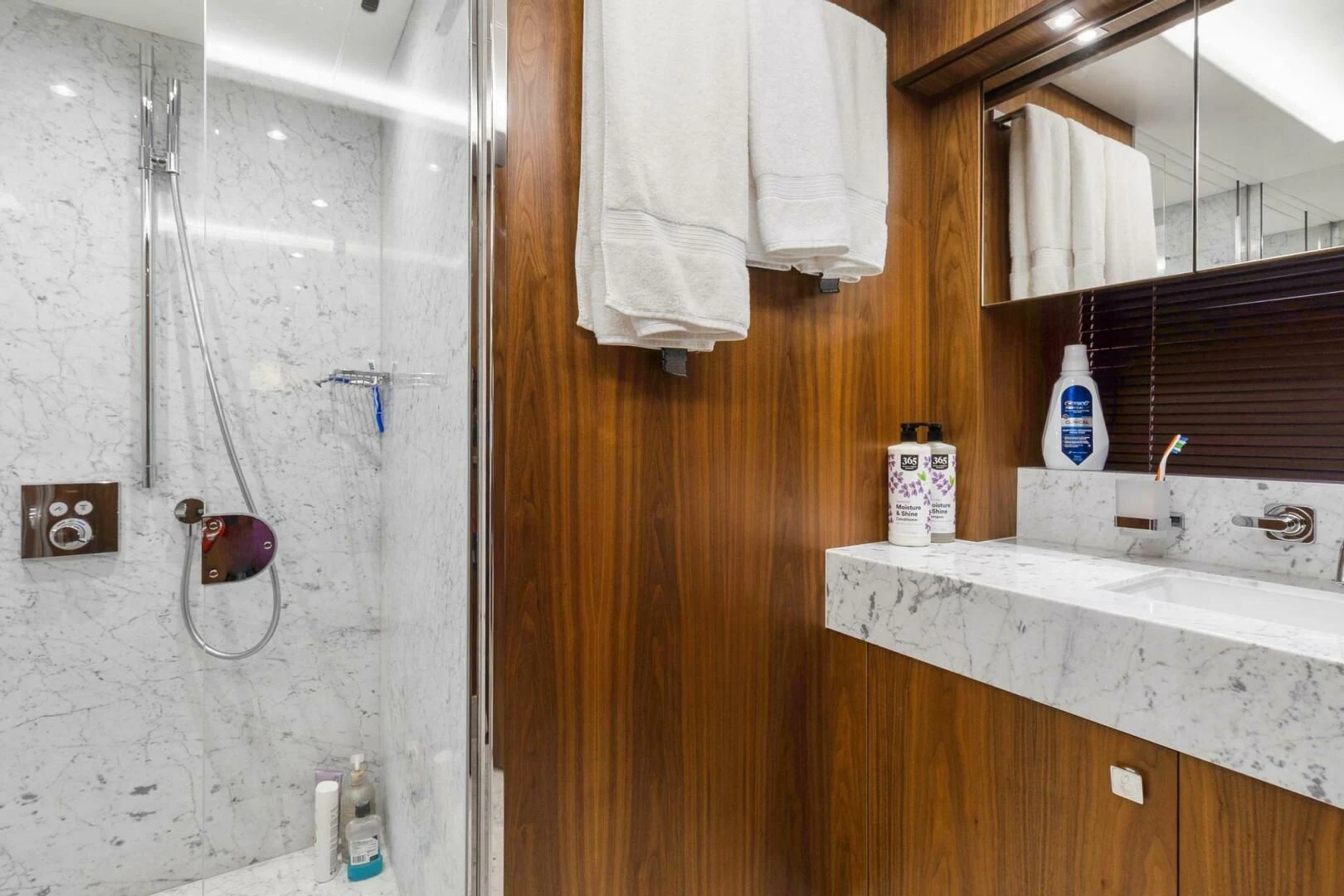 a bathroom with a sink and towels aboard ALEXA Yacht for Sale