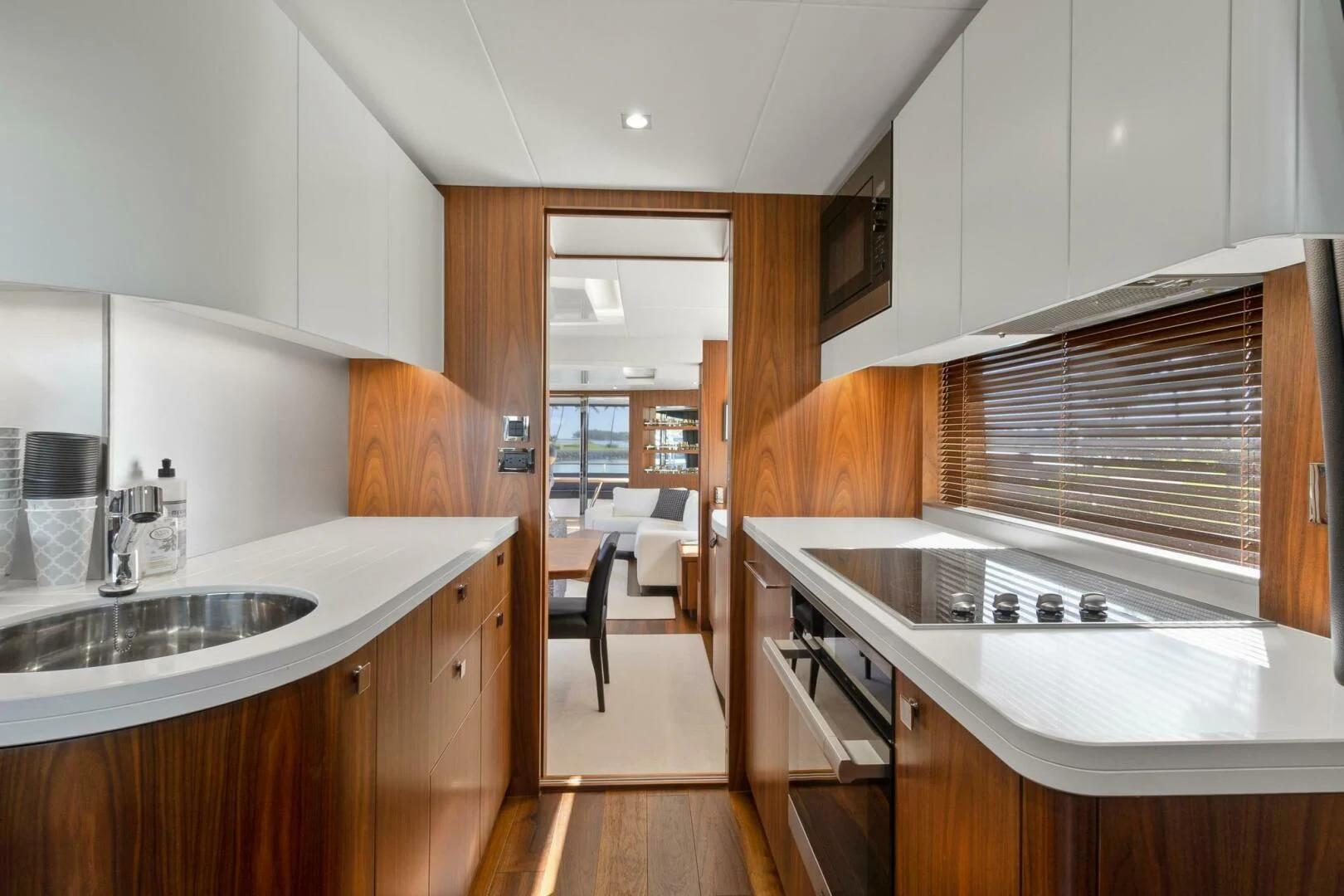 a kitchen with a sink and a stove aboard ALEXA Yacht for Sale