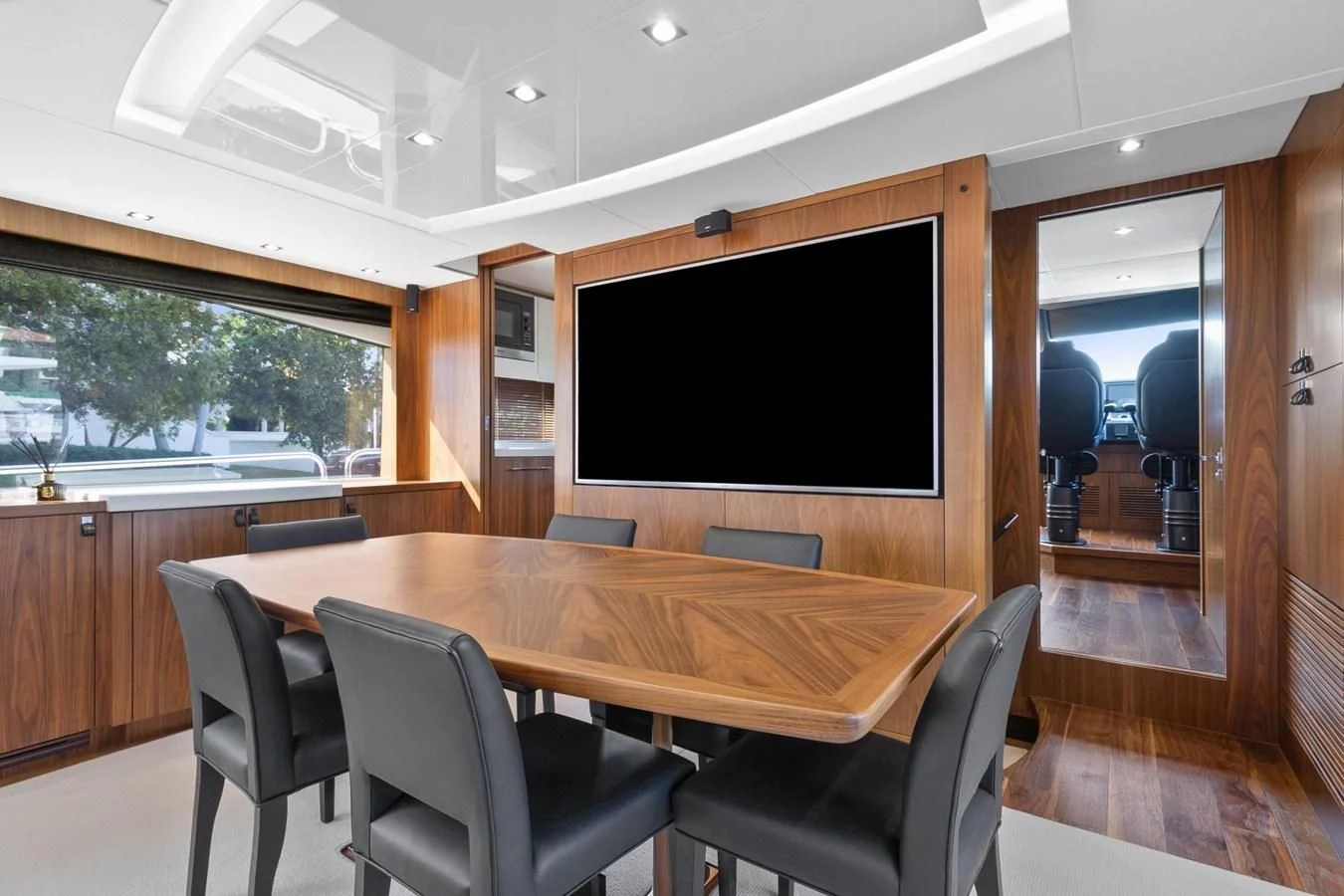 a table and chairs in a room aboard ALEXA Yacht for Sale