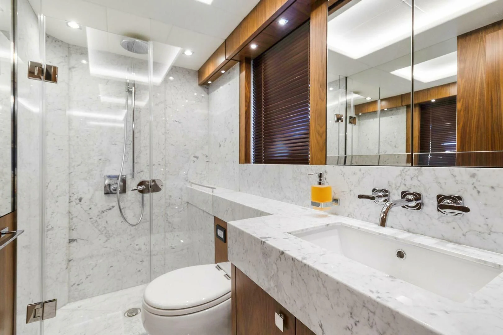 a bathroom with a glass shower aboard ALEXA Yacht for Sale