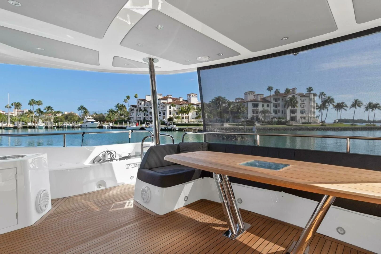 a table and chairs on a deck aboard ALEXA Yacht for Sale