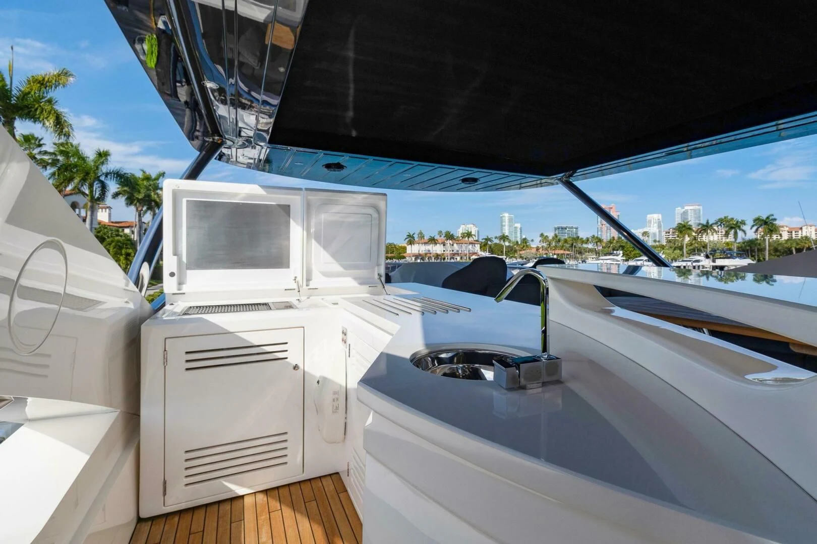a white car with a door open aboard ALEXA Yacht for Sale