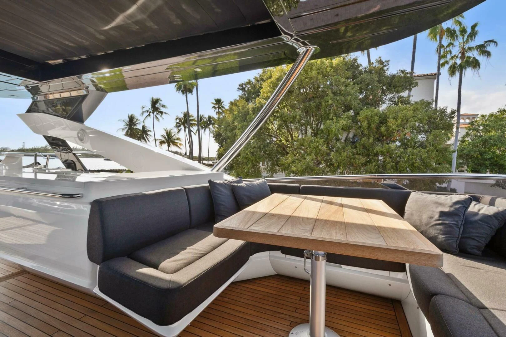 a lounge area with a couch and a table and a pool aboard ALEXA Yacht for Sale