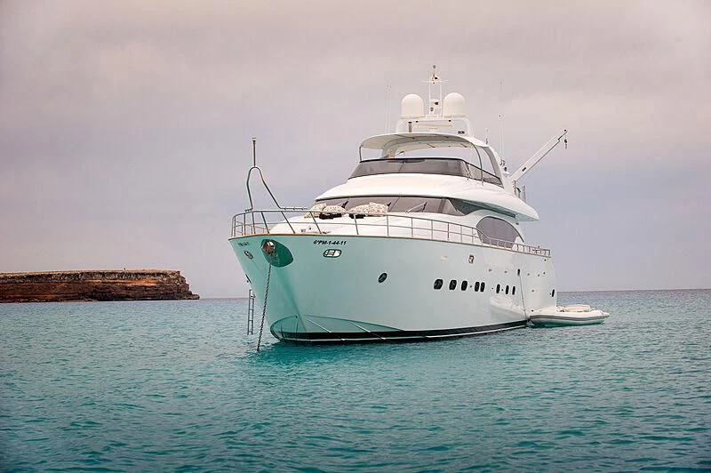 a large white boat in the water aboard LEX Yacht for Sale