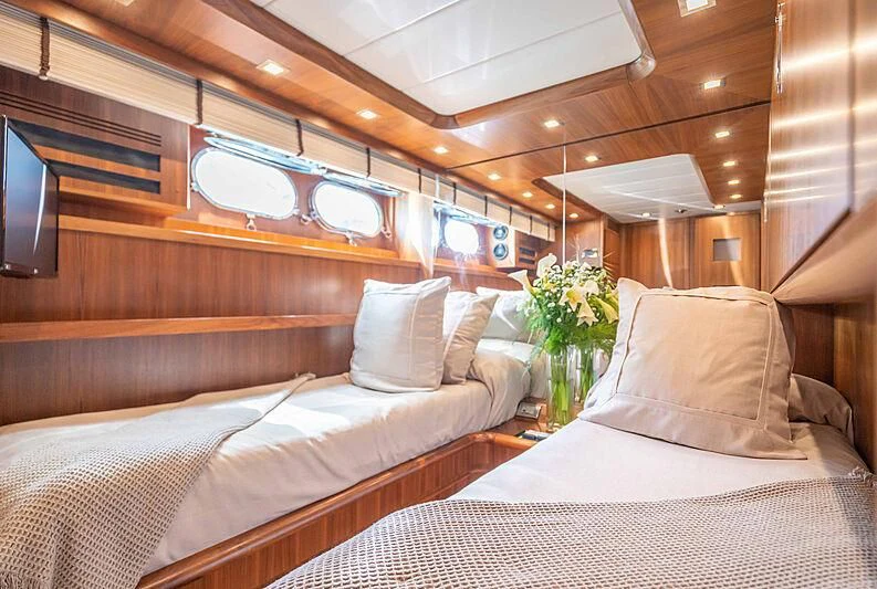 a room with two beds aboard LEX Yacht for Sale