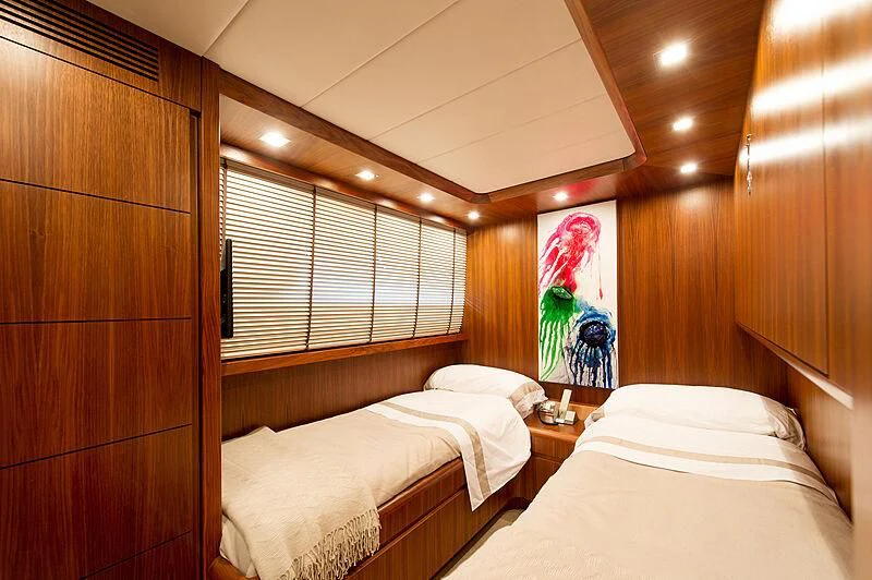a room with two beds aboard LEX Yacht for Sale