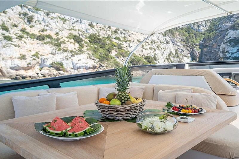 a table with food on it aboard LEX Yacht for Sale