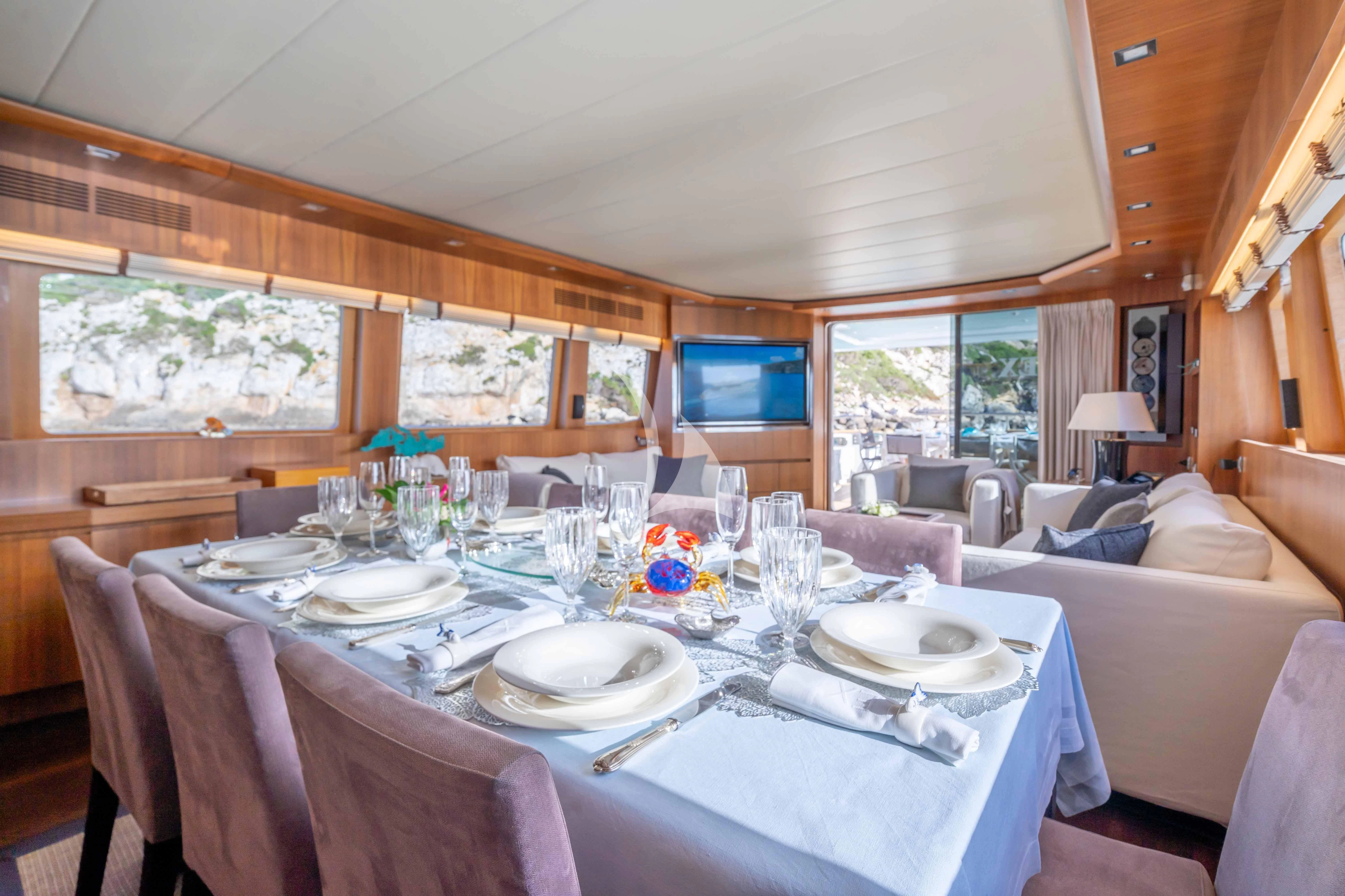 a dining table set for a dinner aboard LEX Yacht for Sale