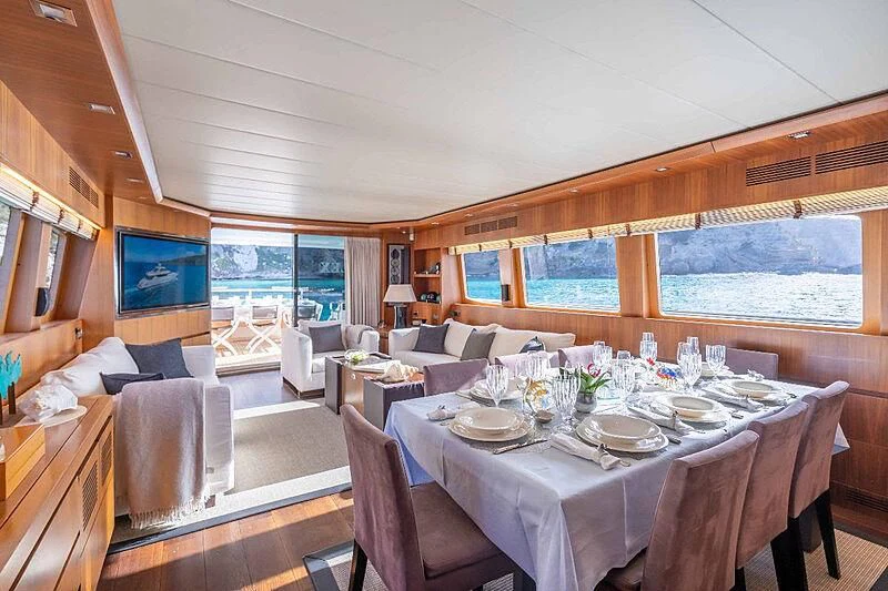 a dining table set for a meal aboard LEX Yacht for Sale