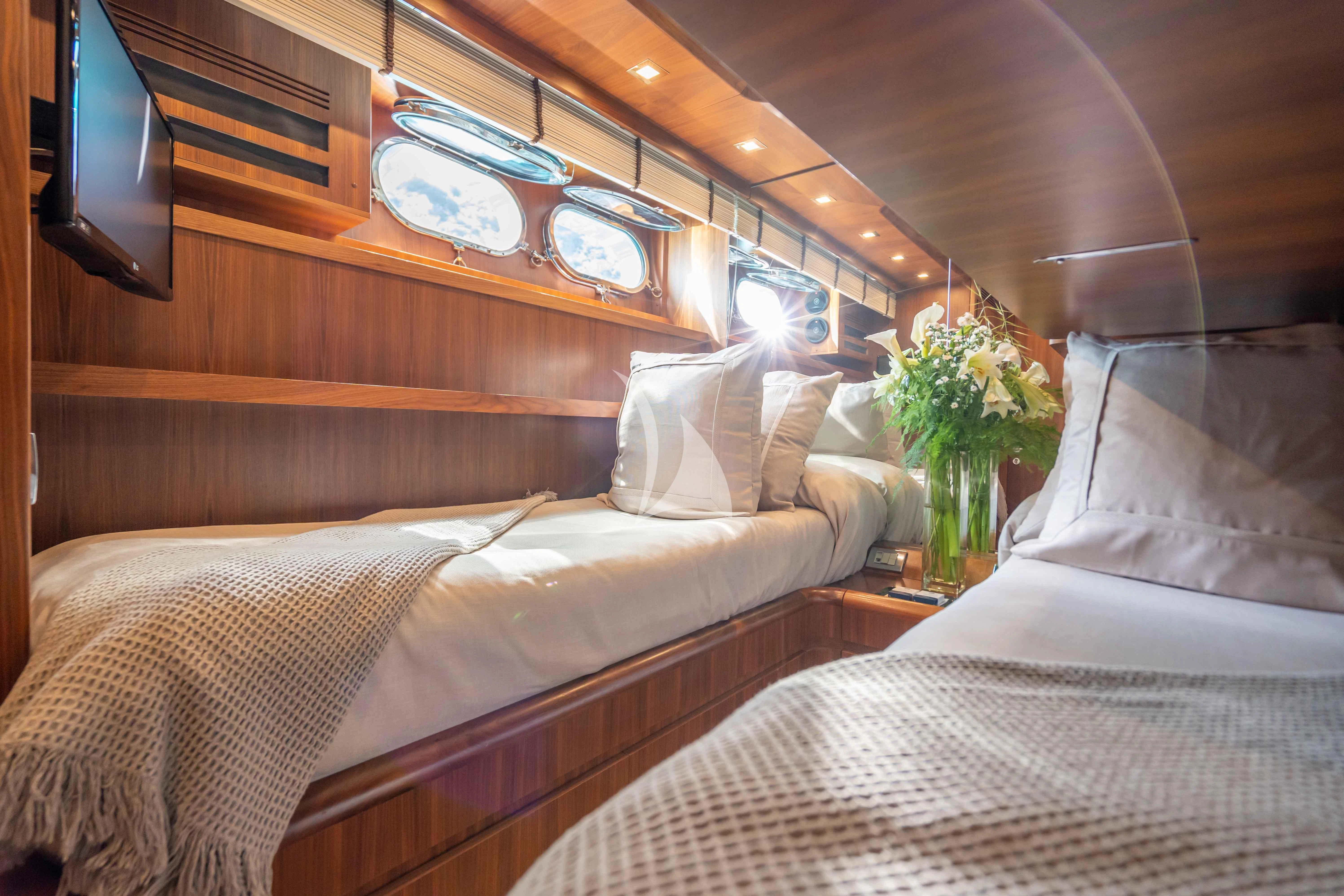 a couple of beds in a room aboard LEX Yacht for Sale