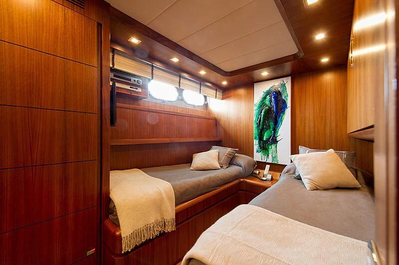a room with two beds aboard LEX Yacht for Sale