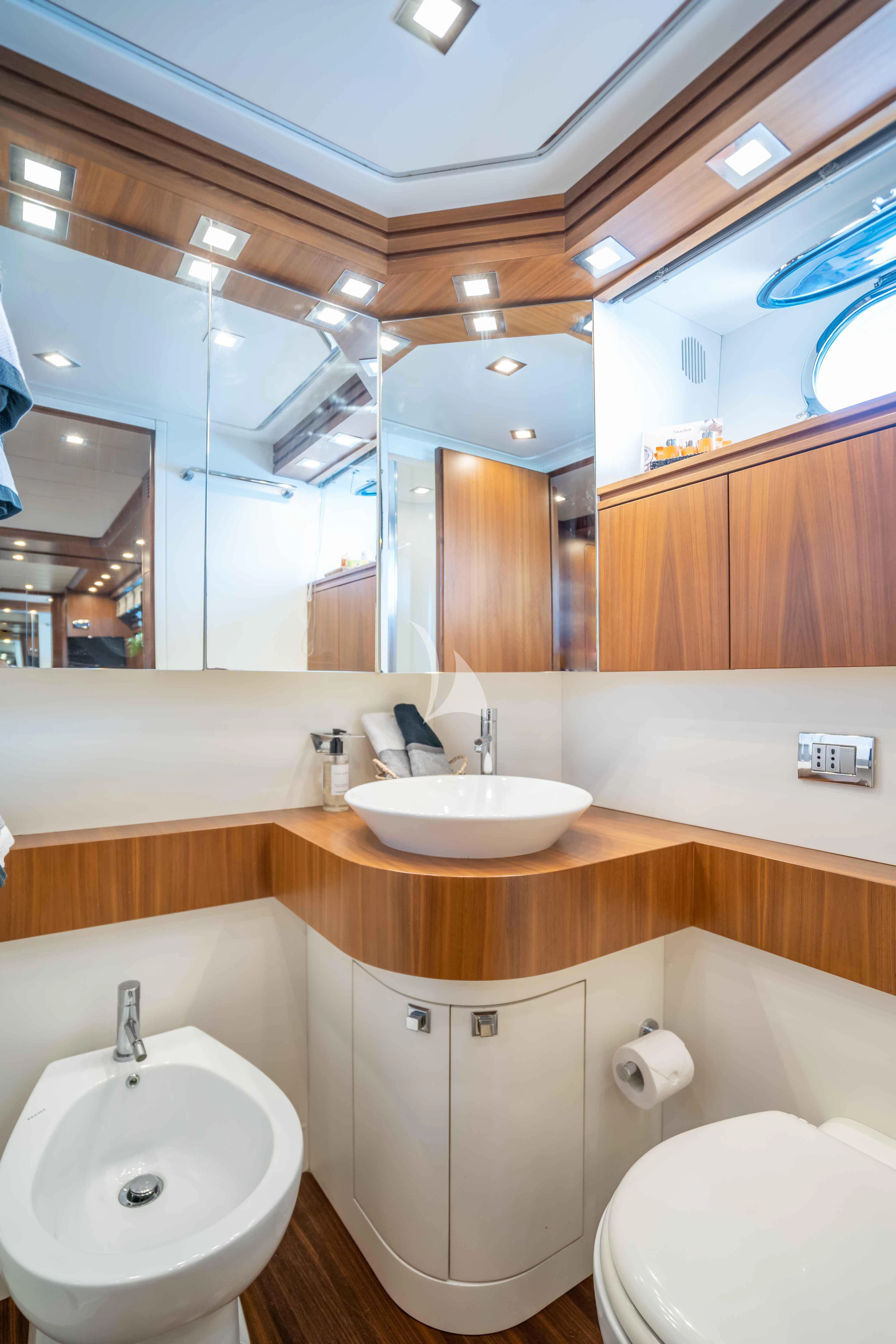 a bathroom with a sink and a toilet aboard LEX Yacht for Sale