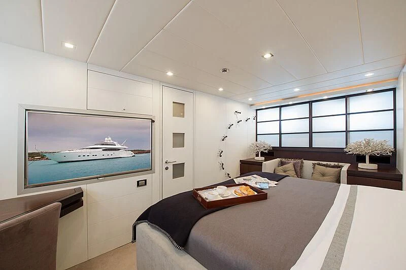 a large room with a large tv aboard LEX Yacht for Sale