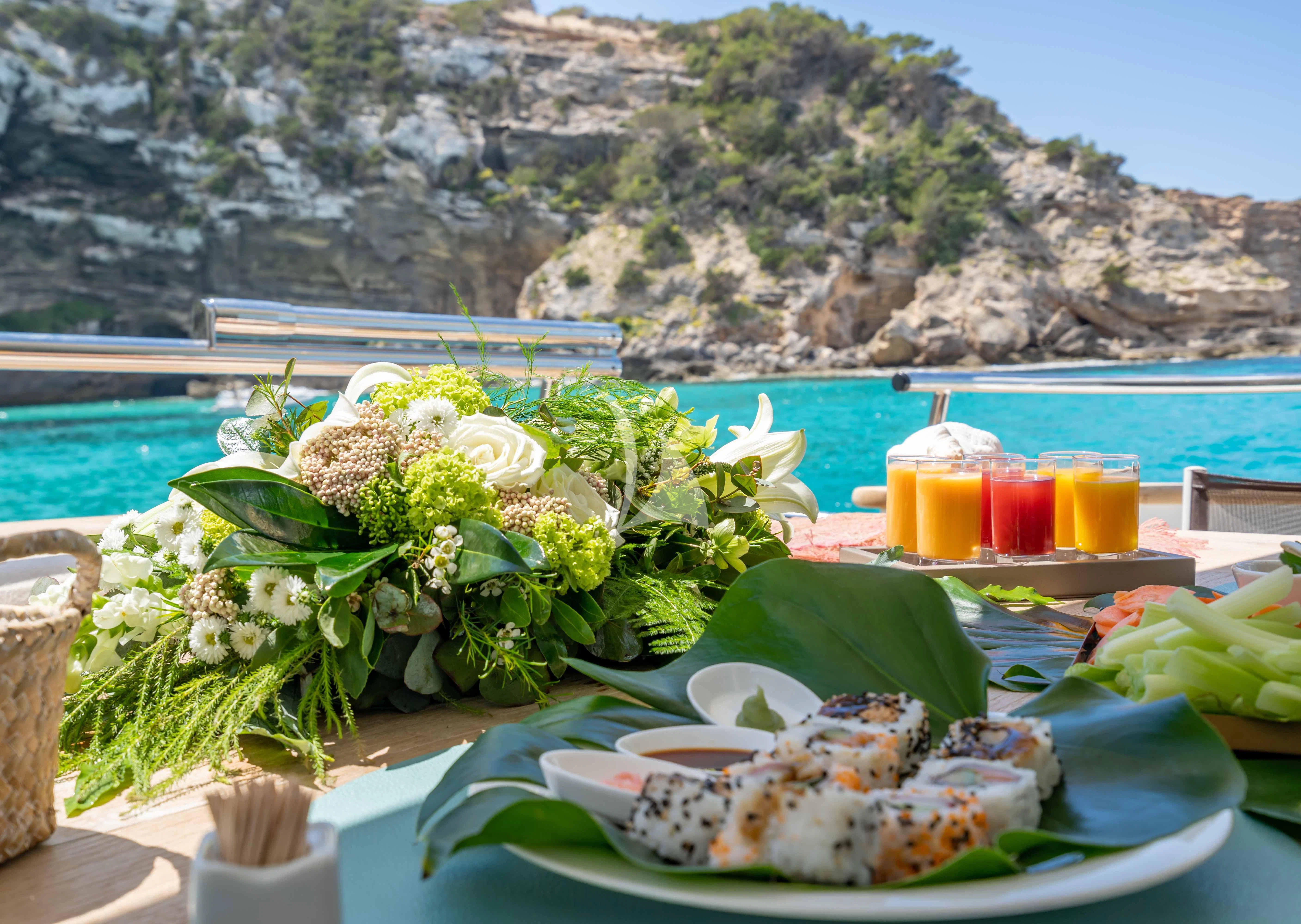 a table with food on it aboard LEX Yacht for Sale
