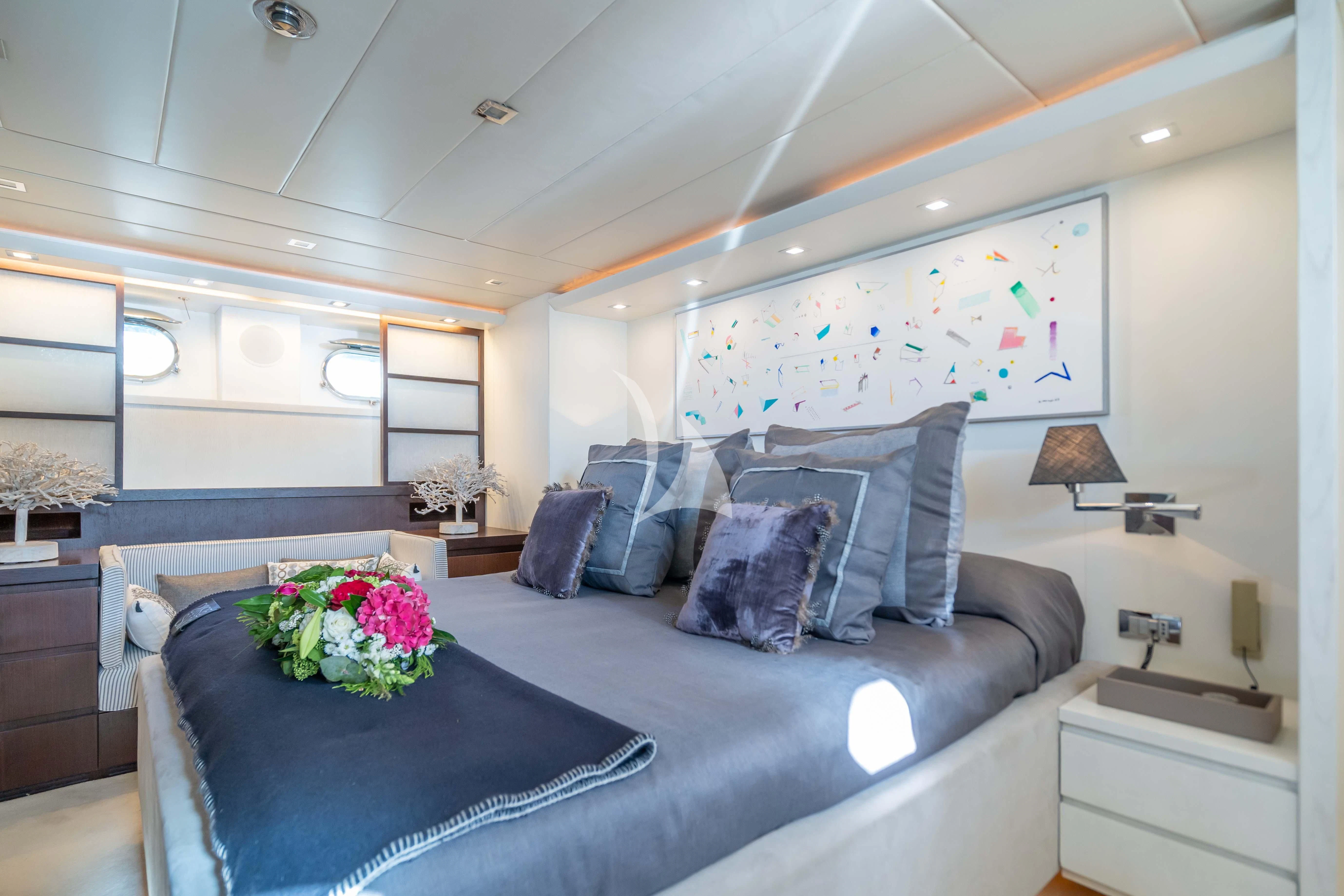 a living room with a couch and a table aboard LEX Yacht for Sale