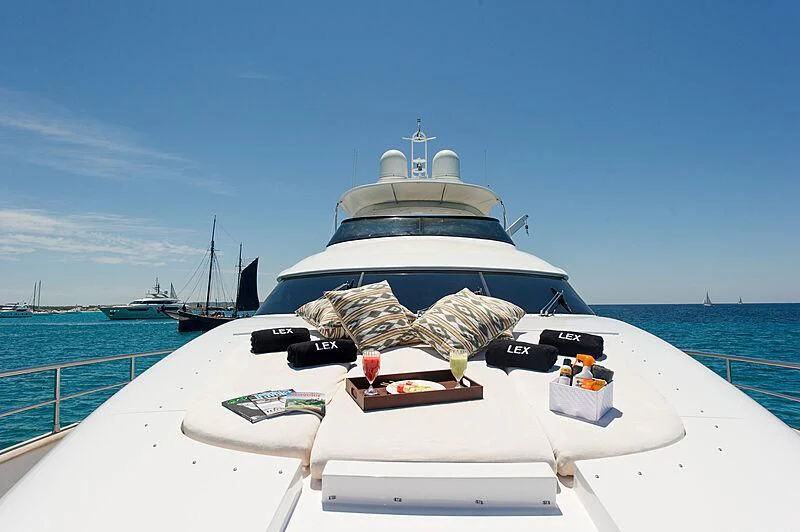 a small white boat with a large fish on it aboard LEX Yacht for Sale